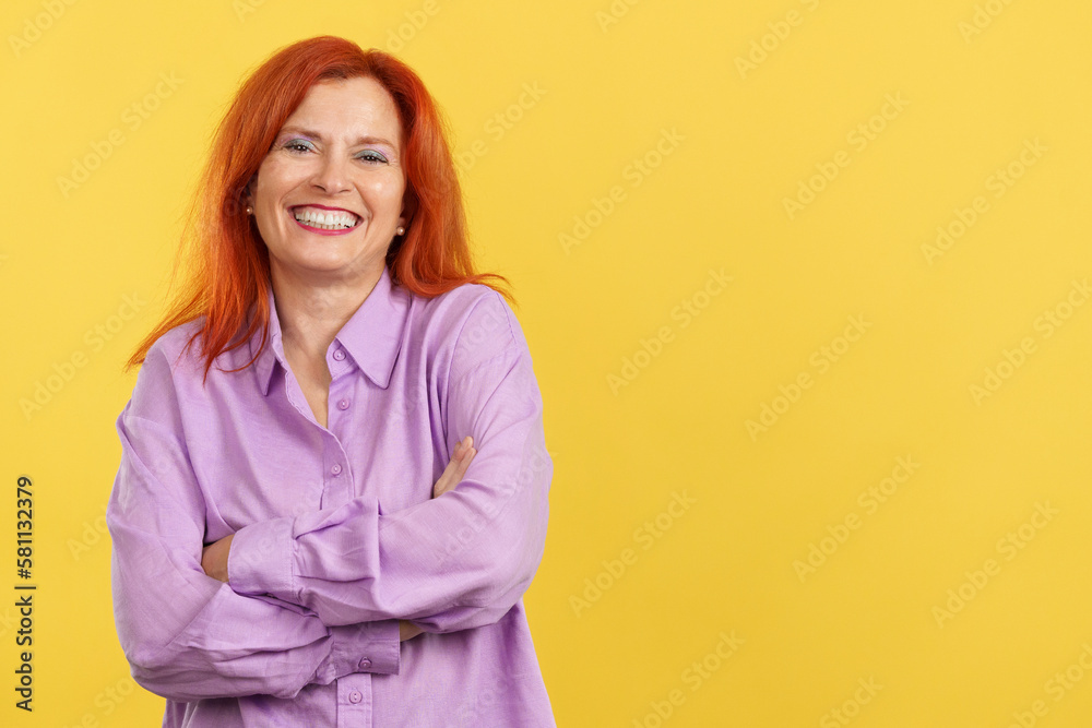 Happy mature woman laughing and looking at the camera Happy mature woman laughing and looking at the camera