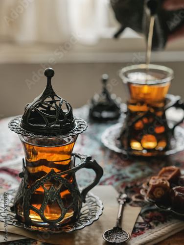 A cup of tea as takjil or ifthar or berbuka in Ramadhan mont photo