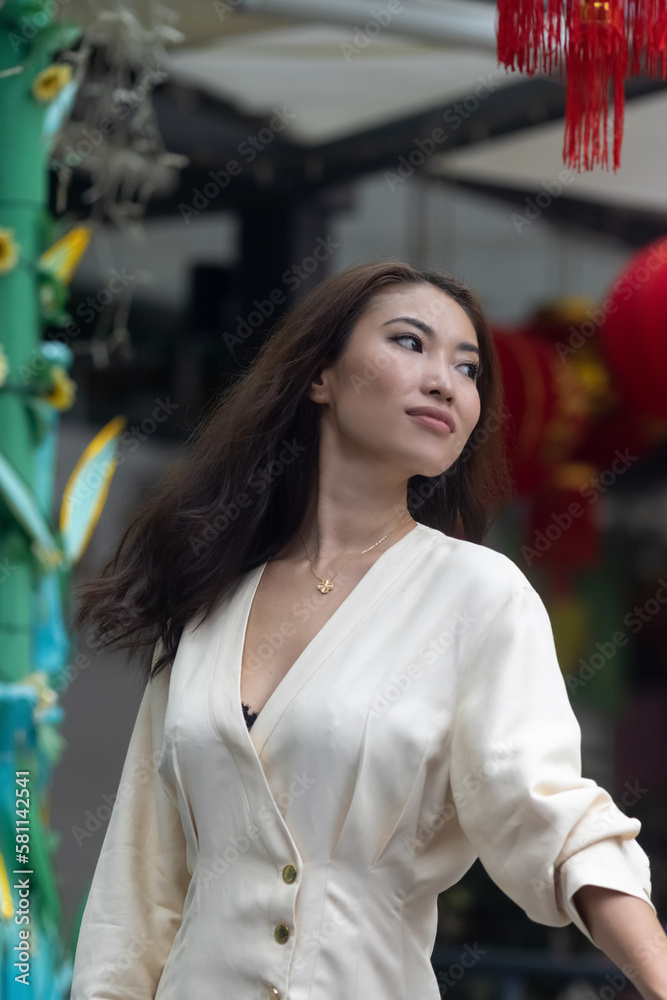 Beautiful Asian girl in white dress with attractive facial structure, ideal for makeup hair modeling Chinese lanterns. Beautiful Asian girl in white dress with attractive facial structure, ideal for makeup hair modeling Chinese lanterns.