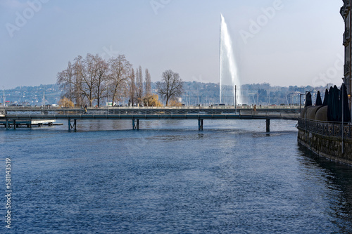 Rhone river with Mont Blanc Bridge and Lake Geneva in the background at Swiss City of Geneva on a sunny late winter day. Photo taken March 5th, 2023, Geneva, Switzerland.