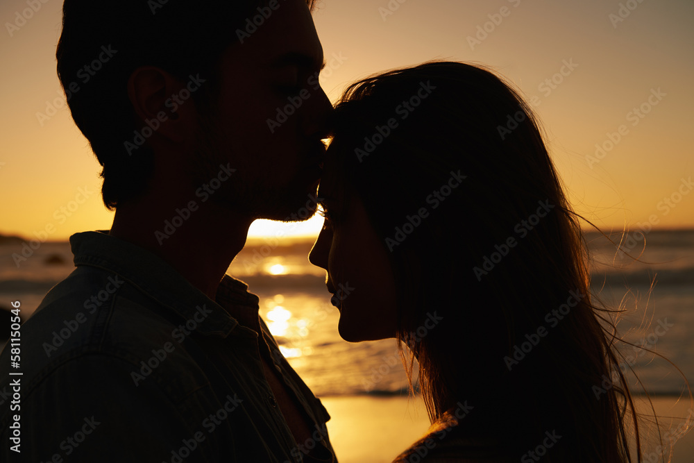 Youre everything to me. A young couple expressing their love at sunset on the beach. Youre everything to me. A young couple expressing their love at sunset on the beach.