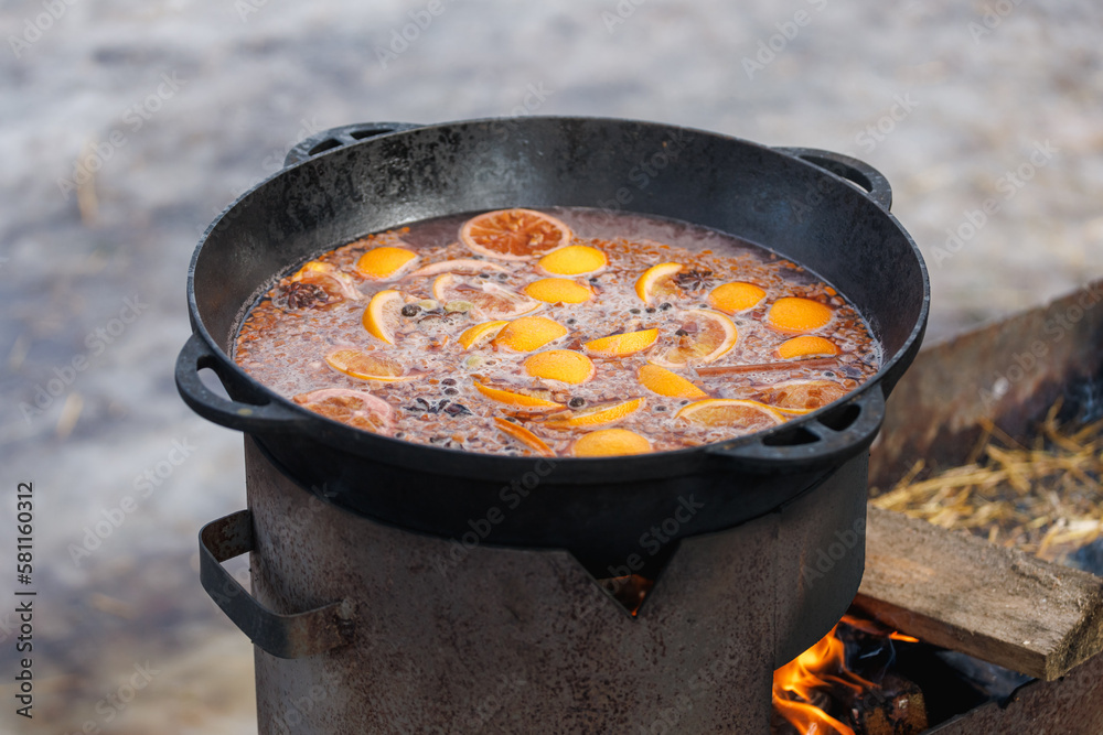 Cooking pancakes in a frying pan on a burning Finnish candle Cooking pancakes in a frying pan on a burning Finnish candle