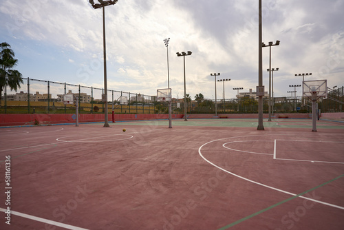 Beautiful view of the court with basketball stands and lampposts