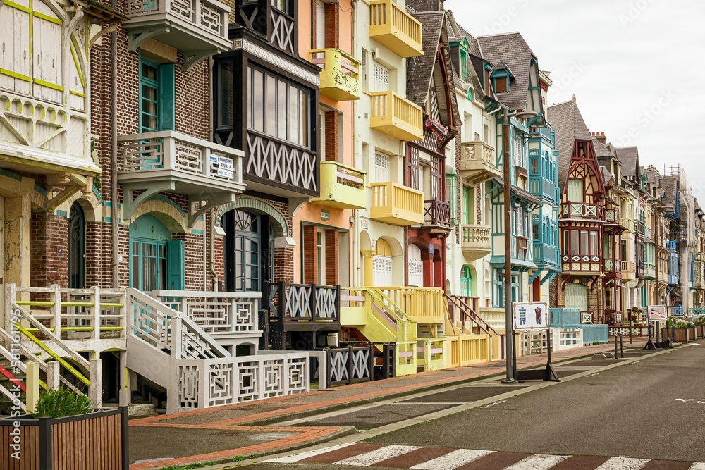 Line of colored houses alongside the coastline of Mers-Les-Bains in Normandy France