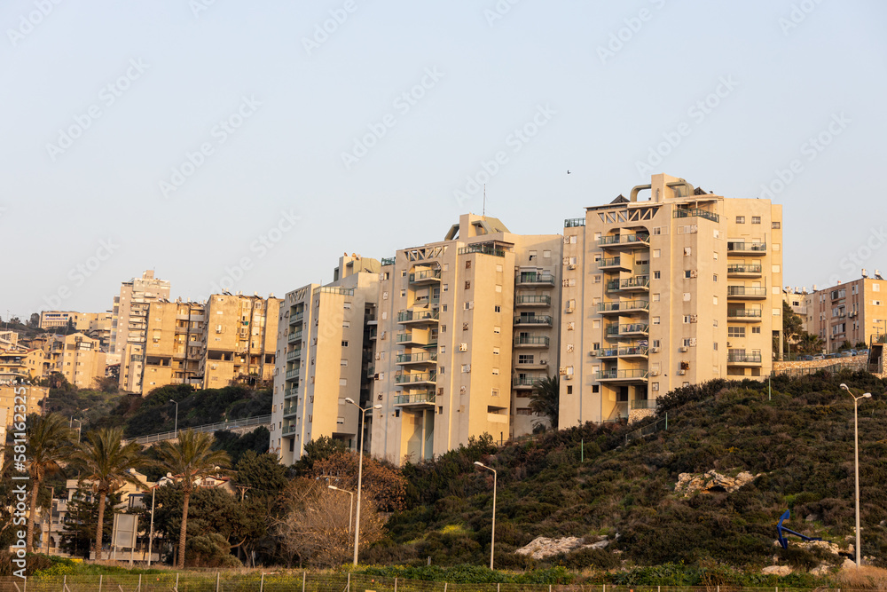 High-rise buildings on a hill in the Shprintsak district at sunset