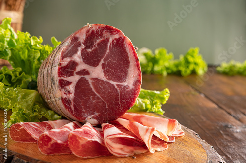 Capocollo or coppa is a traditional Italian and Corsican pork cut made from cured pork shoulder or neck. . Cut into very thin slices. Italian delicacy for aperitivo. Piacentina DOP. 