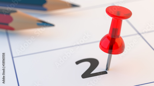 Pin on calendar number 2 second day of month. Conceptual symbol with pencils on a calendar sheet.