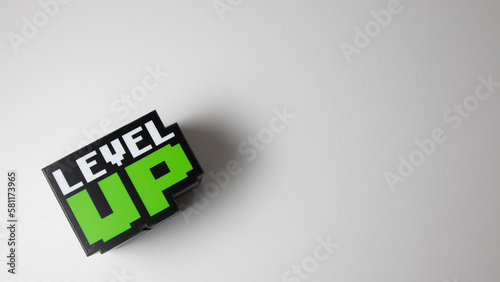 3D Illustration of the word Level up with white background and space for text