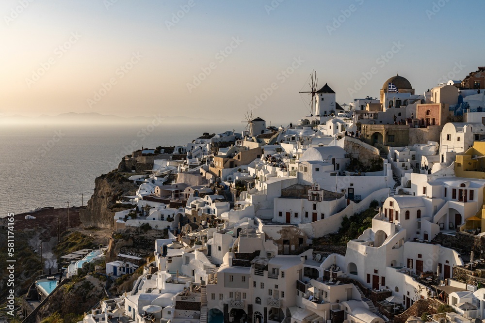 Oia Town in Santorini with  traditional Cycladic houses overlooking the Sea, Greece