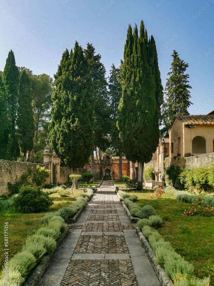 Vertical shot of the Garden of the Prior at Saint Lawrence Charterhouse Monastery in Italy.