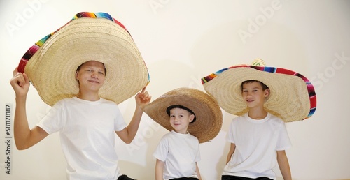 three boys in sambrero hats  photo