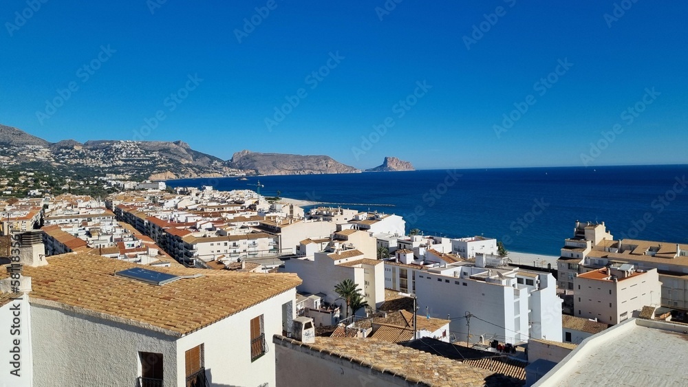 Beautiful view of buildings on a hill and the sea in Altea, Spain