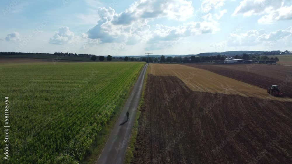 Dolly shot over a partially harvested field at an agricultural area Dolly shot over a partially harvested field at an agricultural area