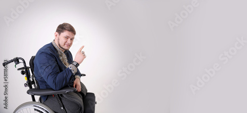 banner white where man in embroidered shirt on wheelchair shows thumbs up concept of prosthetics treatment life opportunities second life photo