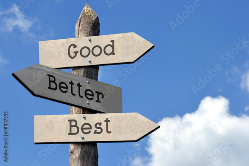 Good  better  best - wooden signpost with three arrows  sky with clouds