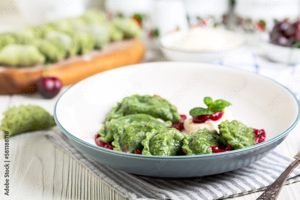Cherry dumplings (pierogies) with cherry sauce.