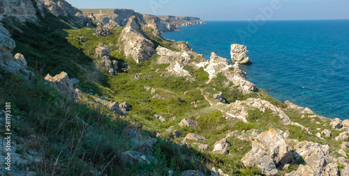 View of the steep banks and rocks in the water in the Dzhangul tract, western Crimea photo