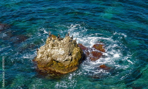 Rocks and islands in the water of the Black Sea near the landslide coast of Dzhangul in the western Crimea, Tarkhankut
