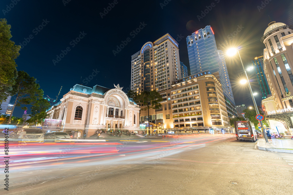 Busy night view of Saigon Opera House or Municipal Theater in Ho Chi Minh City, Vietnam. It built in 1897 by French architect Ferret Eugene.