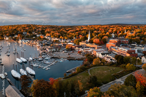 Panoramic view of sea harbor Camden, Maine town on east coast in New England, USA during sunrise in autumn season with fall foliage landscape photo