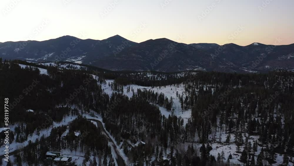 Aerial view of snowy mountains in Colorado landscape at sunset - 4K Drone Aerial view of snowy mountains in Colorado landscape at sunset - 4K Drone