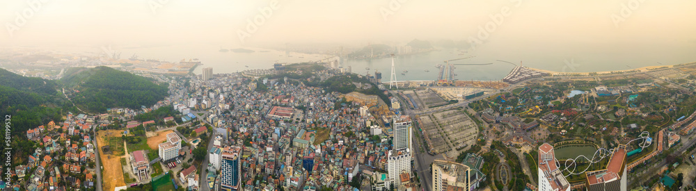 Naklejka premium Aerial view of Bai Chay Bridge is located on Highway 18, connecting two parts of Ha Long City, Hon Gai City and Bai Chay City through Cua Luc Bay, which flows into Ha Long Bay