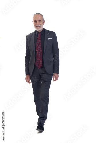 front view of a man walking with suit and tie on white background