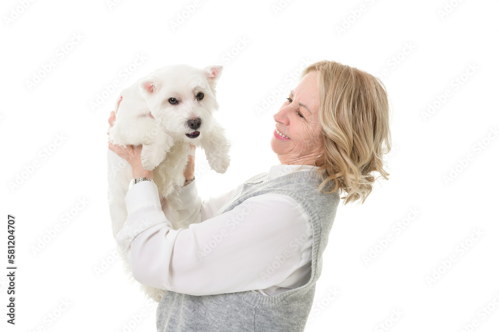 Cheerful retired senior woman with dog and enjoying time with pet on studio white Cheerful retired senior woman with dog and enjoying time with pet on studio white
