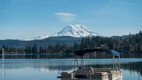 Tableau sur toile Clear lake and pontoon boat with Mount Rainier, Washington landscape in winter