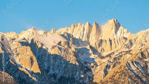 Panoramic view of Mount Whitney peak with snow and glaciers during sunrise in the Alabama Hills, California USA