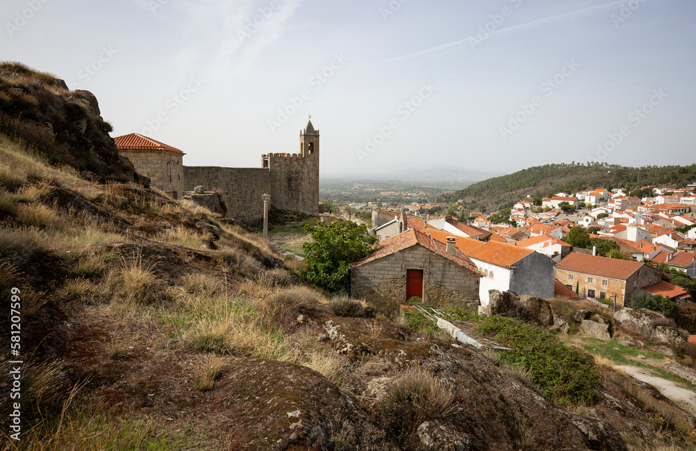 a view of the clock tower on the castle wall and Penamacor town, district of Castelo Branco, Beira Baixa, Portugal - October 2022