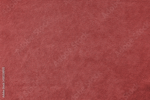Texture background of velours red fabric. Upholstery velveteen texture fabric, corduroy furniture textile material, design interior, decor. Ridge fabric texture close up, backdrop, wallpaper.
