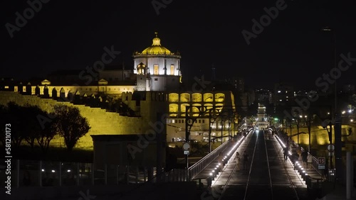 Night city view with amazing architecture. Action. Building with yellow illumination on a black sky background. photo