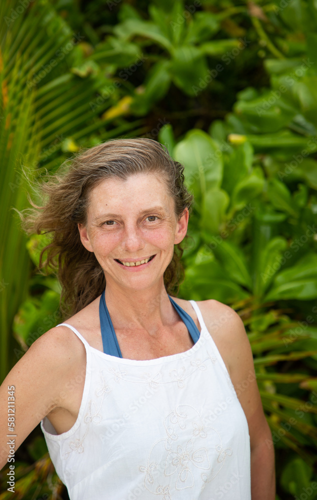 woman portrait and lush tropical greenery woman portrait and lush tropical greenery