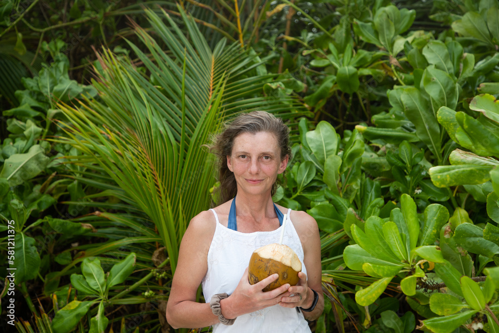 woman portrait and lush tropical greenery woman portrait and lush tropical greenery