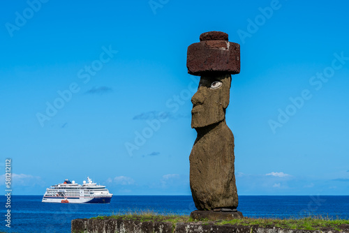 Side view of the moai of Ahu Ko Te Riku with headgear and eyes on Easter Island (Rapa Nui), Chile. The Ahu Ko Te Riku is the only ceremonial platform on Easter Island where you can see a complete moai photo