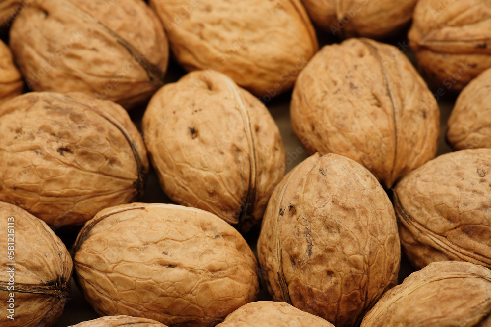 Walnut close up on a wooden table. Walnut close up. product rich in minerals and vitamins. Walnut close up on a wooden table. Walnut close up. product rich in minerals and vitamins.