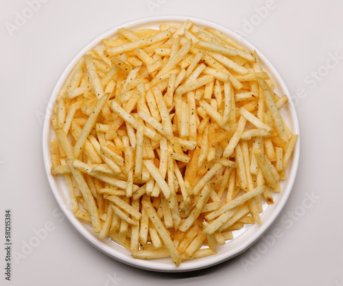 French fries background, closeup shot. Delicious potatoes with a golden fried crust. French fries background. Potato straw
