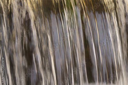 Waterfall. Blurred Background With A Stream Of Water