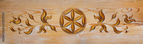 Part of a decorative ornament on a wooden board in traditional Podhale Style olso known as Polish Highlanders Style