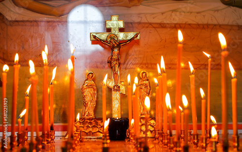Panakhida, funeral liturgy in the Orthodox Church. Christians light candles in front of the Orthodox cross with a crucifix and sacrificial bread. Concept of Orthodox faith and religion.