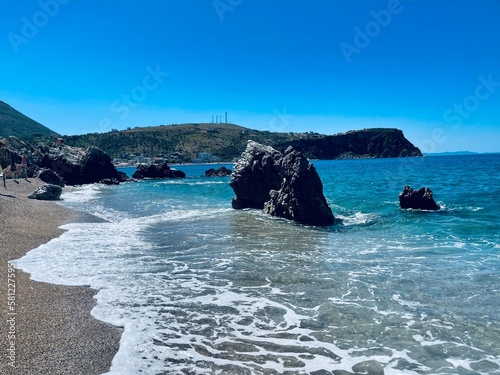 Rocky beach and crystal turquoise water of Ionian Sea in Albania. photo