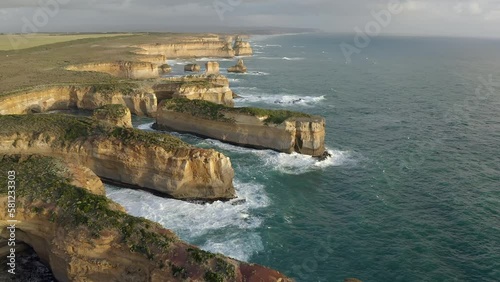 Aerial: 12 Apostles Great Ocean Road Australia Port Campbell National Park Cliffs in on the Coast of Pacific Ocean Evening Sun Popular touristic place