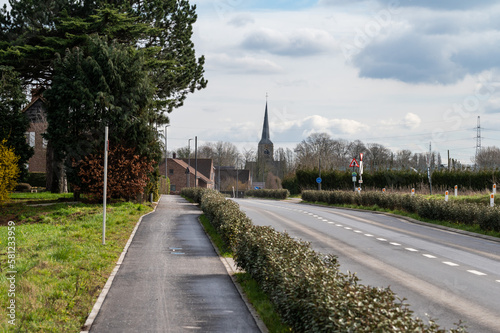 Biking road and motorway towards the village of Ternat, Belgium