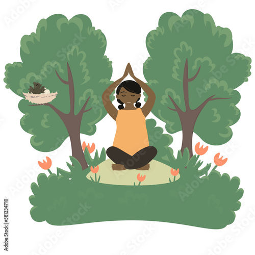 A dark-skinned girl in nature does yoga and sports.