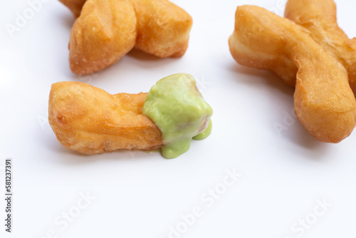 Deep-fried dough sticks or chinese bread sticks with with pandan custard dip