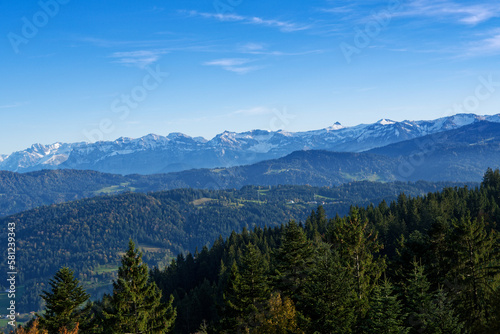 Beautiful alpine landscape with green meadows, alpine cottages and mountain peaks, Austria