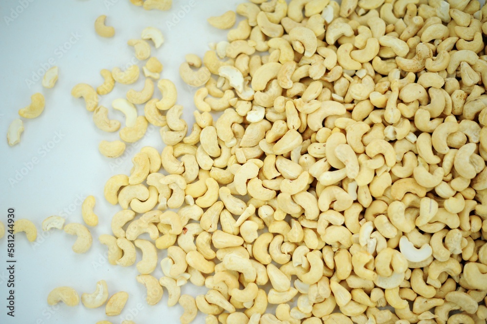 Tasty cashew nuts as background, top view Big pile of cashew nuts isolated on white background. Package design element with clipping path High quality photo Tasty cashew nuts as background, top view Big pile of cashew nuts isolated on white background. Package design element with clipping path High quality photo