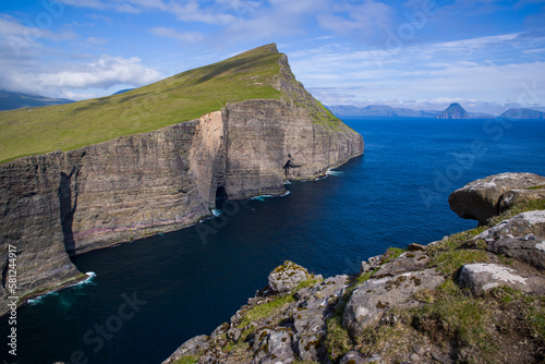 Lake above the ocean trail in Faroe Islands