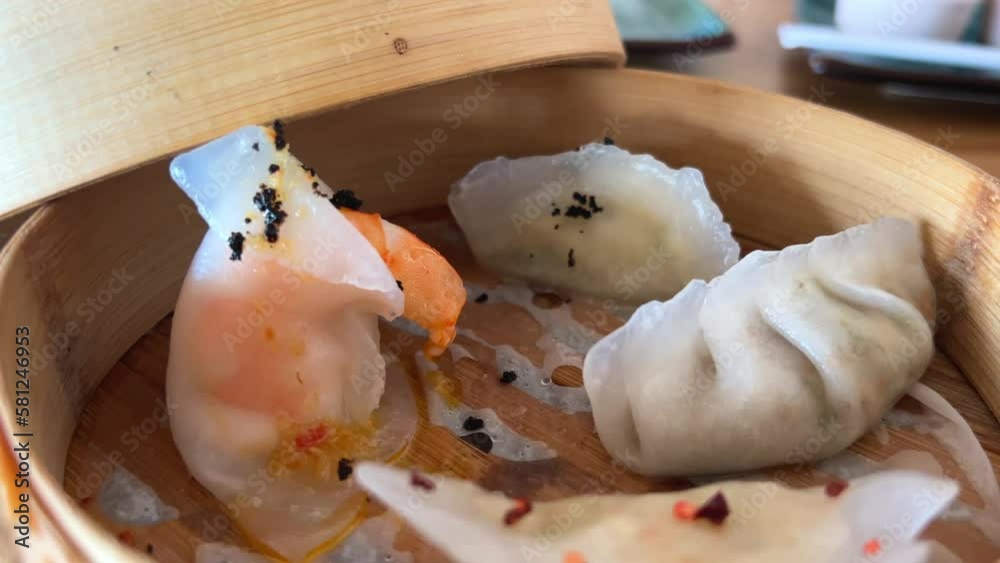 dim sam 4 types with different fillings Wooden boxes covered with a